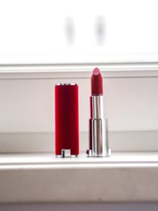 Lipstick on a windowsill.